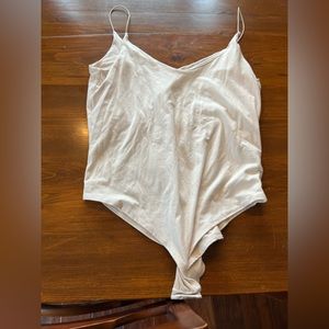 Thin strapped white bodysuit